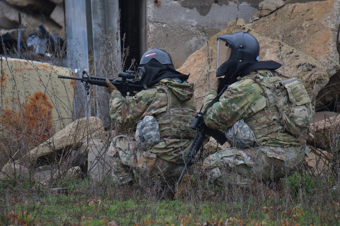 U.S. Air Force security forces and explosive ordnance disposal specialists assigned to the Wisconsin Air National Guard's 115th Fighter Wing engage threats during a tactical combat casualty care scenario April 18, 2024, at Volk Field Air National Guard Base near Camp Douglas, Wisconsin. TCCC implements proven medical practices in battlefield trauma care and provides basic lifesaving techniques to wounded personnel, substantially increasing battlefield survivability. (U.S. Air National Guard photo by Senior Master Sgt. Paul Gorman)