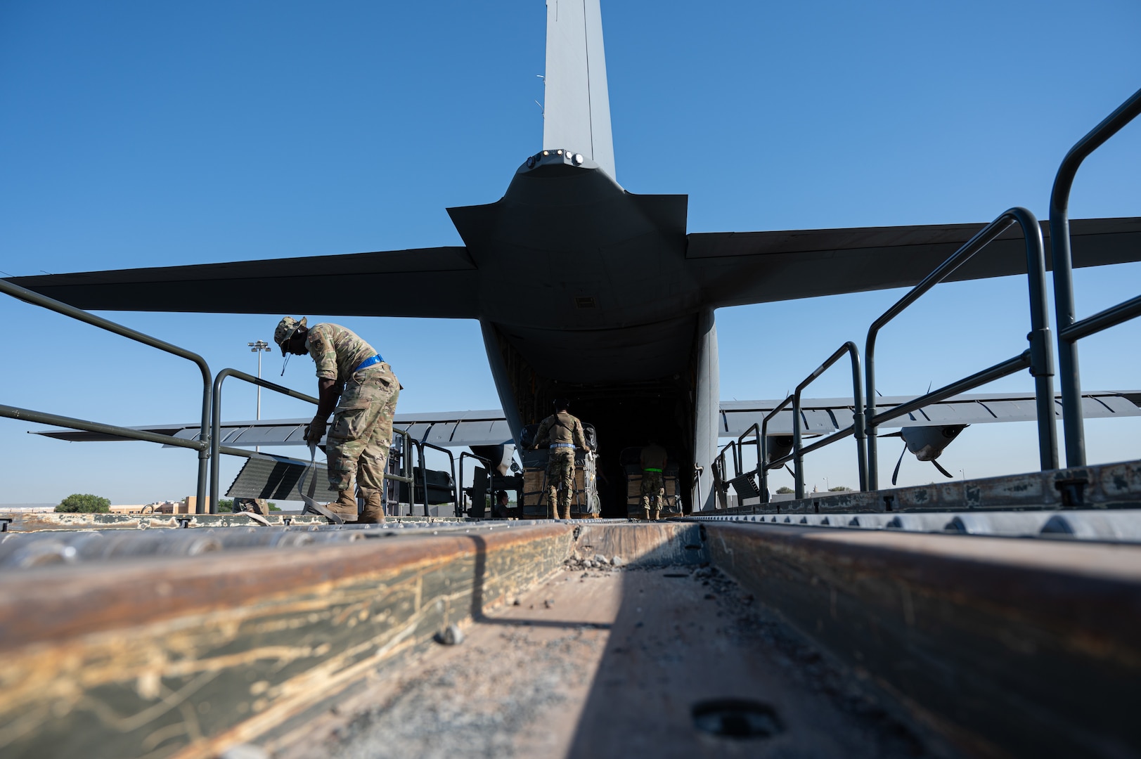 U.S. Air Force port operations Airmen finish loading bundles of humanitarian aid destined for Gaza onto a U.S. Air Force C-130J Super Hercules at an undisclosed location within the U.S. Central Command area of responsibility, May 9, 2024. The U.S. Air Force’s rapid global mobility enables the expedited movement of critical, life-saving supplies to Gaza. (U.S. Air Force photo)