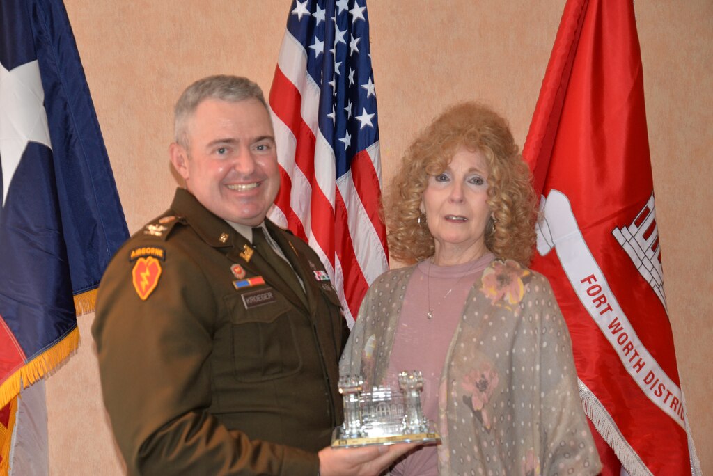 The U.S. Army Corps of Engineers’ Fort Worth District held their annual Administrative Professionals Day luncheon before a packed audience on April 30, at the City Club in Fort Worth. This year, leaders across the district nominated 11 well-deserving administrative professionals for the title of the Fort Worth District’s Administrative Professional of the Year. Col. Calvin Kroeger, commander of the Fort Worth District, presents a crystal castle to this years’ winner, Ms. Lynn Chapman. Chapman has worked for the district for over 19 years, supporting eight different commanders. She is known throughout the district as being wise, fair, and fastidious towards any documents that would see the commander’s eyes.