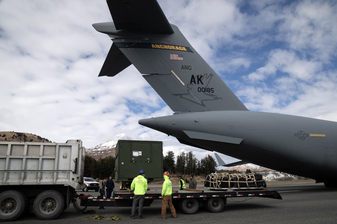 Kodiak logistics personnel offload equipment from an Alaska Air National Guard C-17 Globemaster III assigned to the 144th Airlift Squadron, 176th Wing, during Kodiak Arctic Care 24 Innovative Readiness Training Mission at Kodiak, Alaska, May 6, 2024.