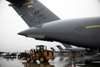 Alaska Air National Guardsmen from the 176th Wing load equipment onto a C-17 Globemaster III in support of Kodiak Arctic Care 24 Innovative Readiness Training Mission at Joint Base Elmendorf-Richardson, Alaska, May 6, 2024.