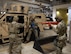 Defenders assigned to the 5th Security Forces Squadron (5th SFS) search a humvee as part of an active shooter drill during Warbird Week at Minot Air Force Base, North Dakota, May 7, 2024. This real-life scenario tested the 5th SFS readiness and response. (U.S. Air Force photo by Airman 1st  Class Luis Gomez)