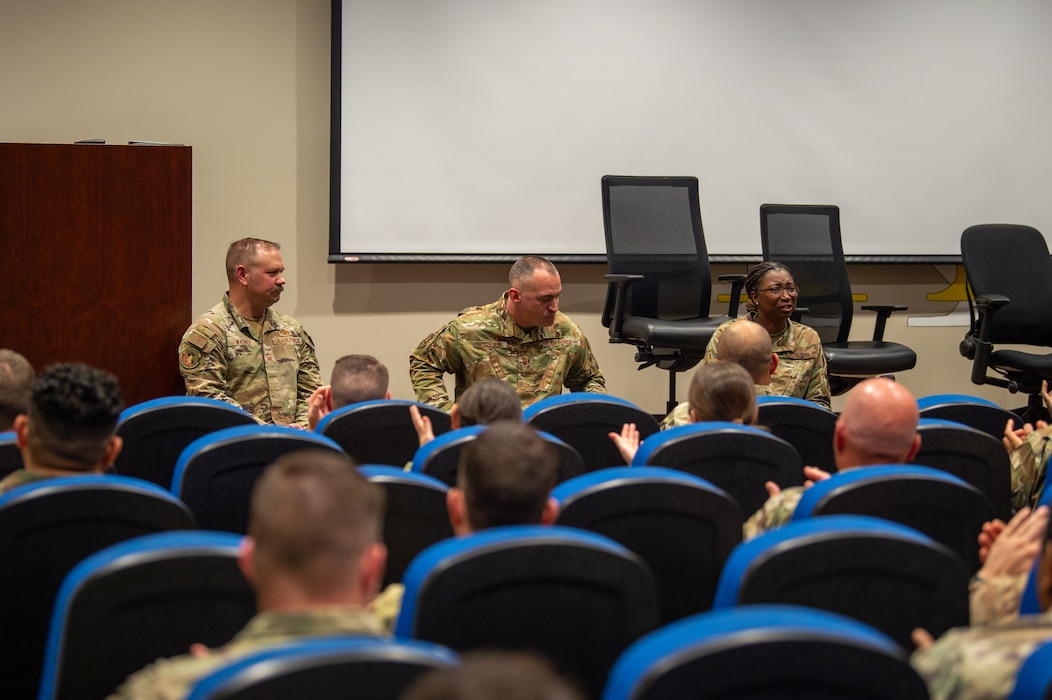 Members of the First Sergeant Symposium applaud the chief’s panel after a brief at Moody Air Force Base, Georgia, May 6, 2024. The panel was an interactive opportunity for attendees to ask questions and learn from the chief’s experiences. (U.S. Air Force photo by Airman 1st Class Iain Stanley)