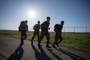 Four Air Force ROTC cadets jog during the Norwegian Foot March.