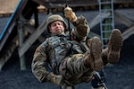 Capt. Michael Johnson conducts a rappelling rehearsal prior to an event at the 2023 Best Medic Competition at Fort Johnson, Louisiana, Jan. 22, 2023. Johnson combines his love of medicine and tactical operations whenever he can. (U.S. Army photo by Joseph Kumzak)