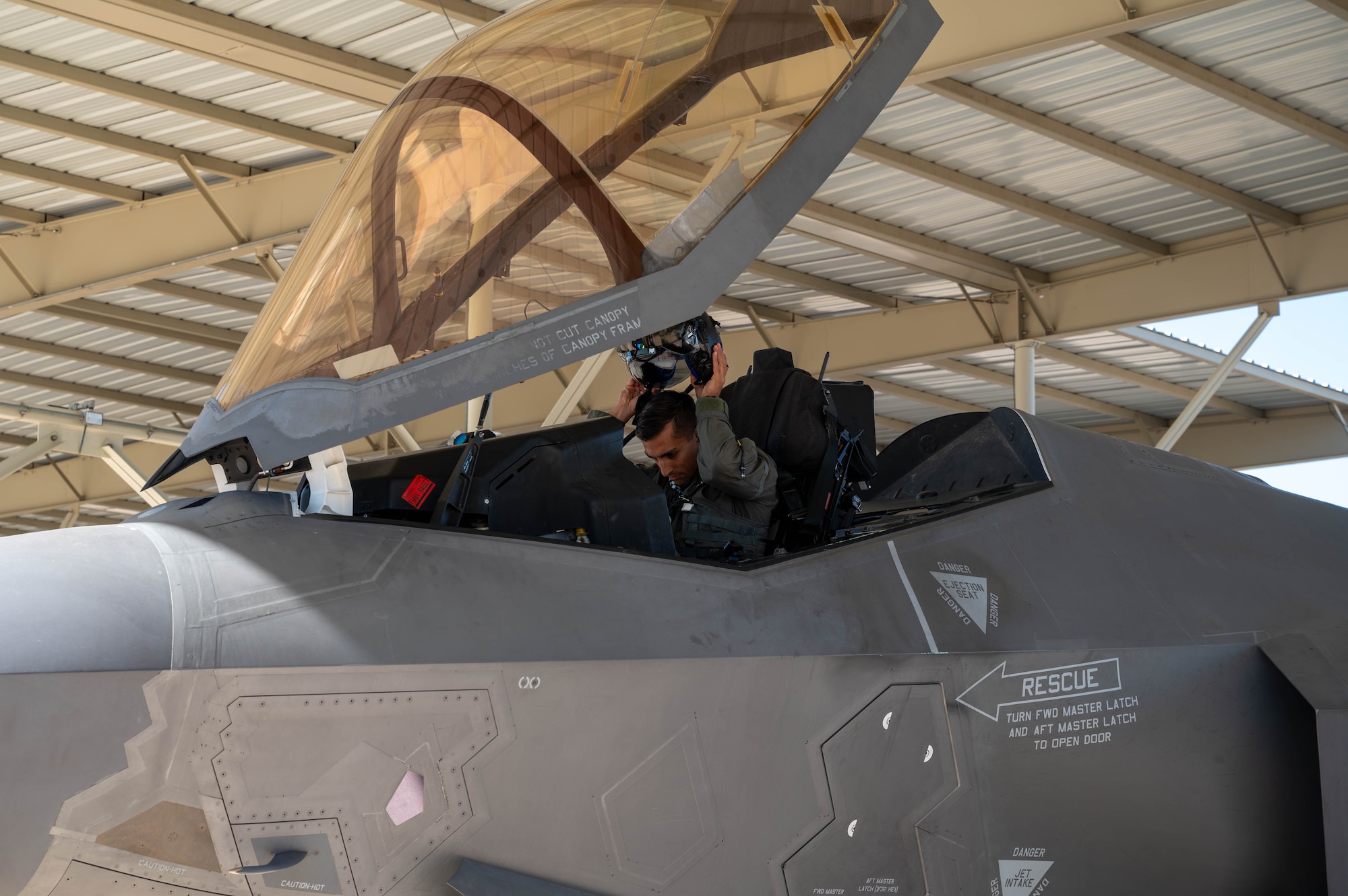 U.S. Air Force Capt. Garrett Ellis, 308th Fighter Squadron instructor pilot, prepares to fly the 100,000th F-35 Lightning II sortie at Luke Air Force Base, Arizona,