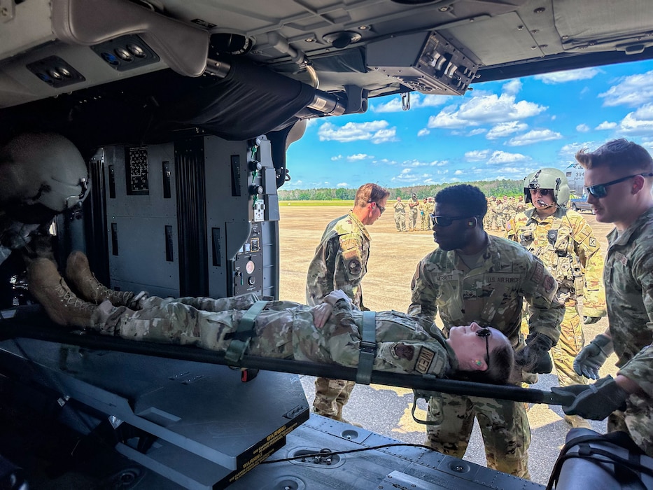 Airmen from the 172nd Medical Group and 183rd Aeromedical Evacuation Squadron load a simulated patient to a UH-60 Black Hawk for Operation Vital Force in Jackson, Mississippi, May 4, 2024. Operation Vital Force is a training exercise designed to evaluate the capabilities of Airmen when responding to natural disasters, aeromedical evacuation, casualty care and mortuary affairs. (U.S. Air National Guard photo by Airman 1st Class Damara Cormier)