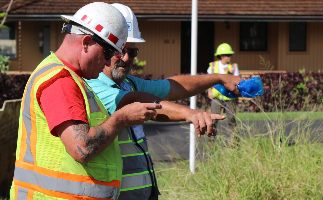 Tyler Hutton, Quality Assurance supervisor from the Walla Walla District, member of the U.S. Army Corps of Engineers Debris Planning and Response Team on Maui, Hawaii prepares to perform a final walk through on a property in the Lahaina impact zone cleared of fire debris with a USACE contractor technical field lead.