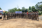 U.S. Marines with 9th Engineer Support Battalion, 3rd Marine Logistics Group, III Marine Expeditionary Force, pose alongside soldiers with the Philippine Army for a group photograph at the conclusion of a groundbreaking ceremony at Alannay Elementary School prior to the commencement of Exercise Balikatan 24 in Cagayan, Philippines, March 26, 2024. BK 24 is an annual exercise between the Armed Forces of the Philippines and U.S. military designed to strengthen bilateral interoperability, capabilities, trust, and cooperation built over decades of shared experiences. (U.S. Marine Corps photo by Cpl. Trent A. Henry)