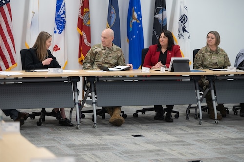 Image of people speaking at table