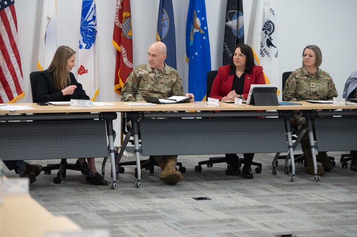 Image of people speaking at table