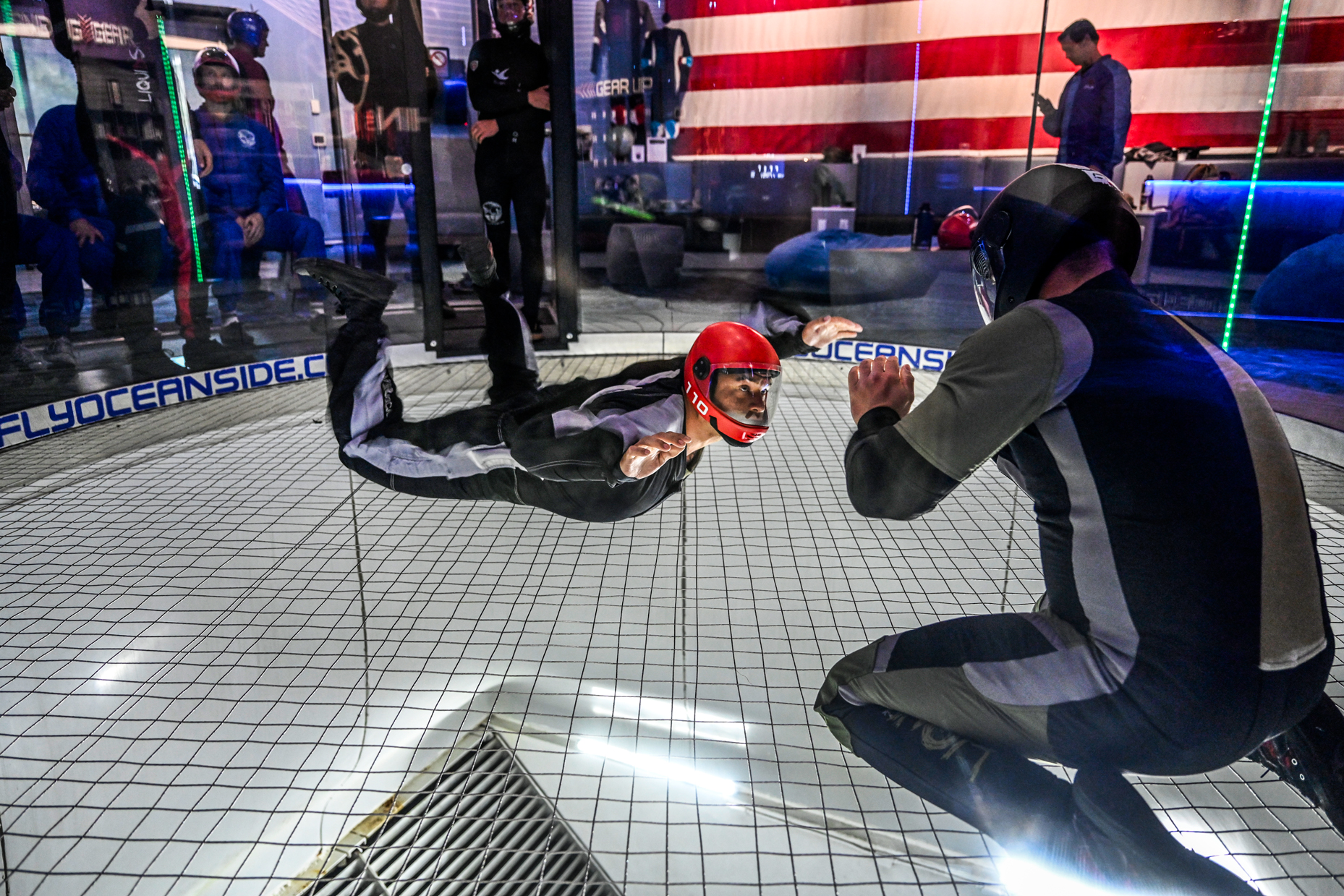 Sailors assigned to West-coast explosive ordnance disposal (EOD) units practice body control techniques in a wind tunnel in preparation for military free fall operations.