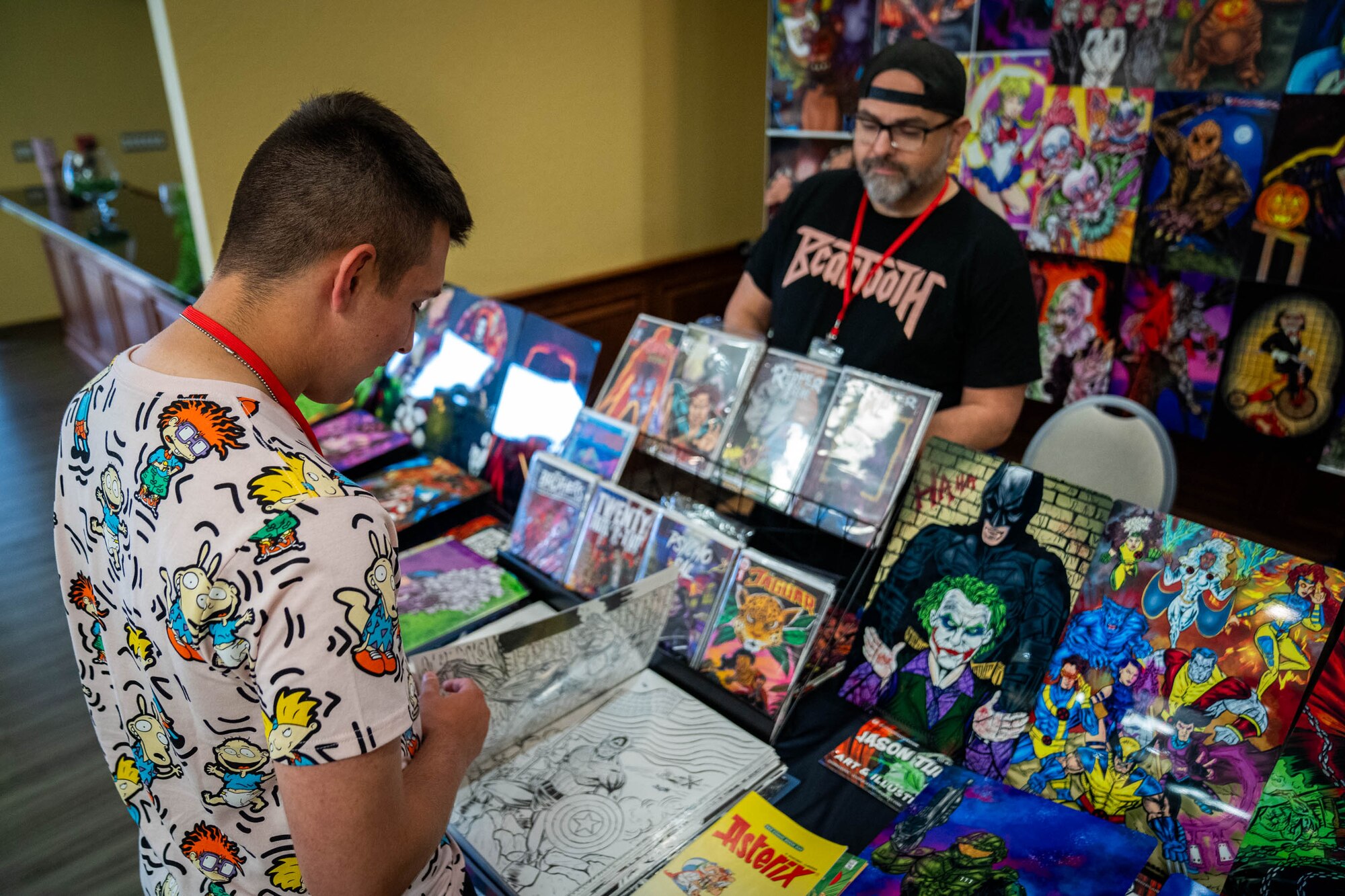 Jason Turner, illustrator and variant cover artist, sells his artwork during Keesler Con and the Eastern Regional Esports Invitational at Keesler Air Force Base, Mississippi, May 4, 2024.