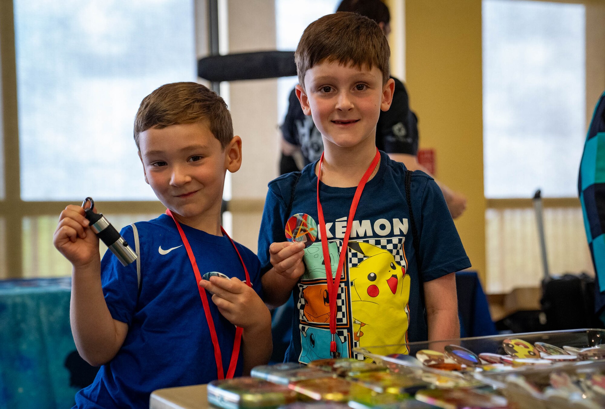 The children of U.S. Air Force Lt. Col. Kevin Brockler, 81st Mission Support Group deputy commander, show off their prizes from Keesler Con and the Eastern Regional Esports Invitational at Keesler Air Force Base, Mississippi, May 4, 2024.