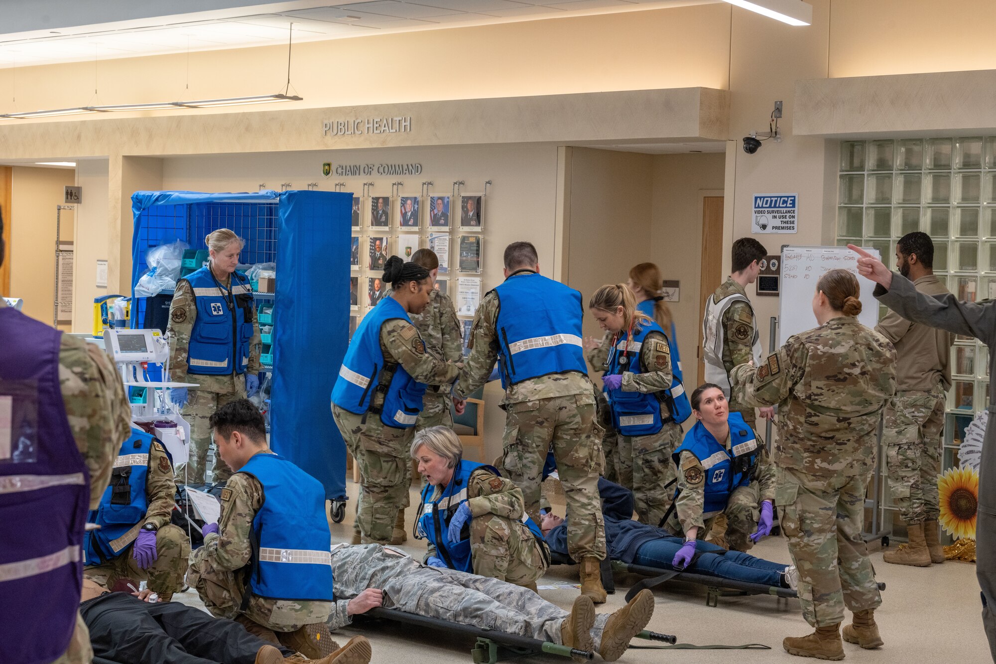 Airmen from the 5th Medical Group (5th MDG) assist patients during training at Minot Air Force Base, North Dakota, May 8, 2024. The scenario simulated an inclement weather scenario where the Minot city hospital was destroyed by a tornado and patients were redirected to the 5th MDG Building. (U.S. Air Force photo by Airman 1st Class Trust Tate)