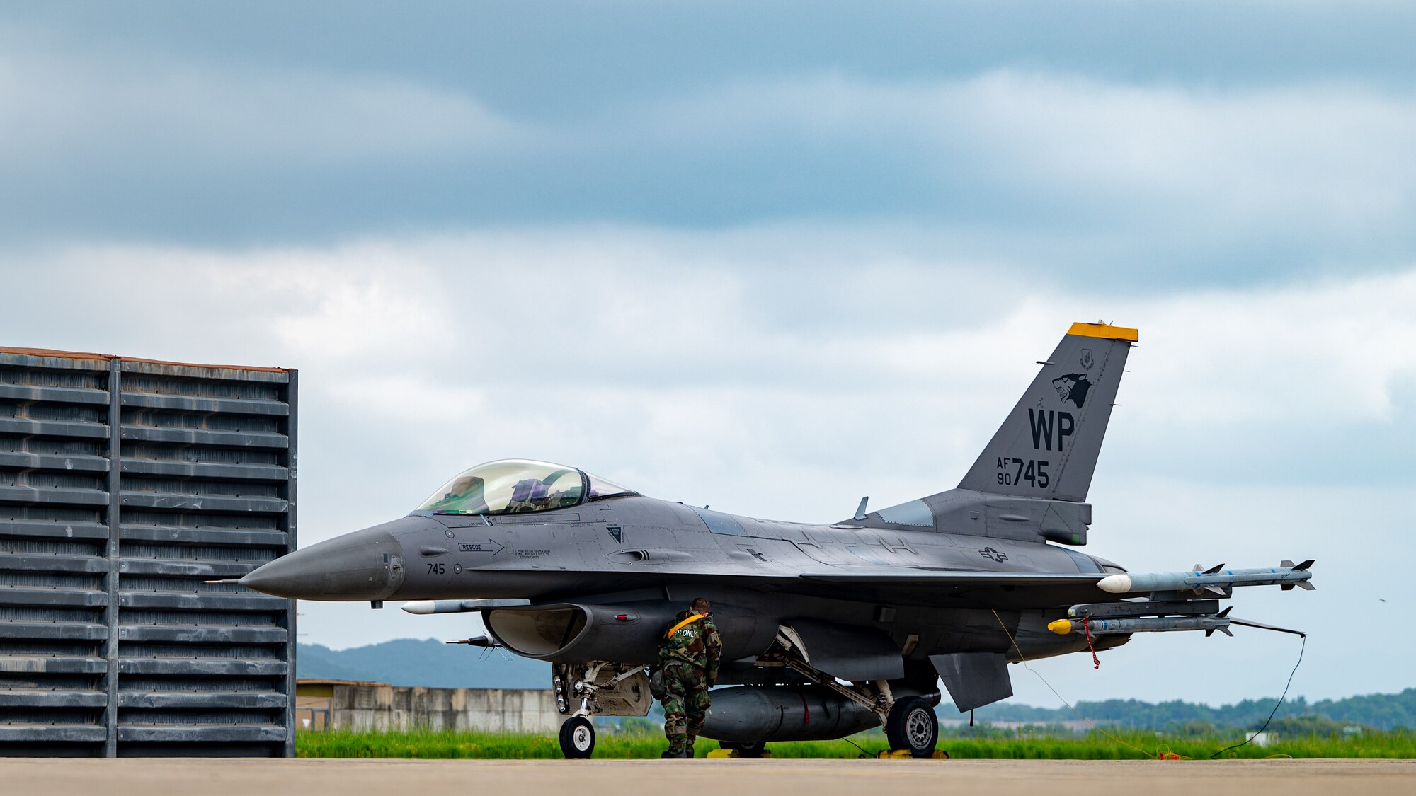 Senior Airmen Dawson Leake provides preventative maintenance on a F-16 Fighting Falcon.
