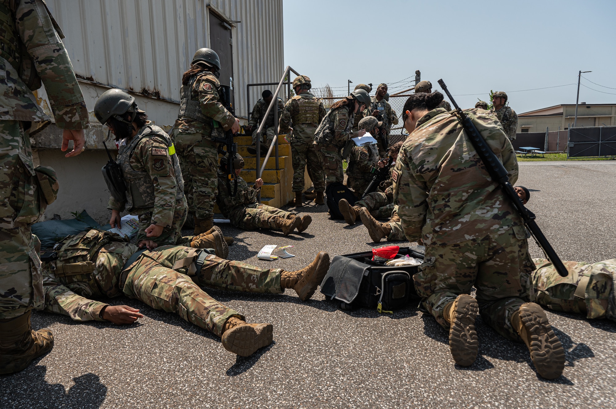 Airmen of the 8th Medical Group go through procedures of a mass casualty in a simulated training event.