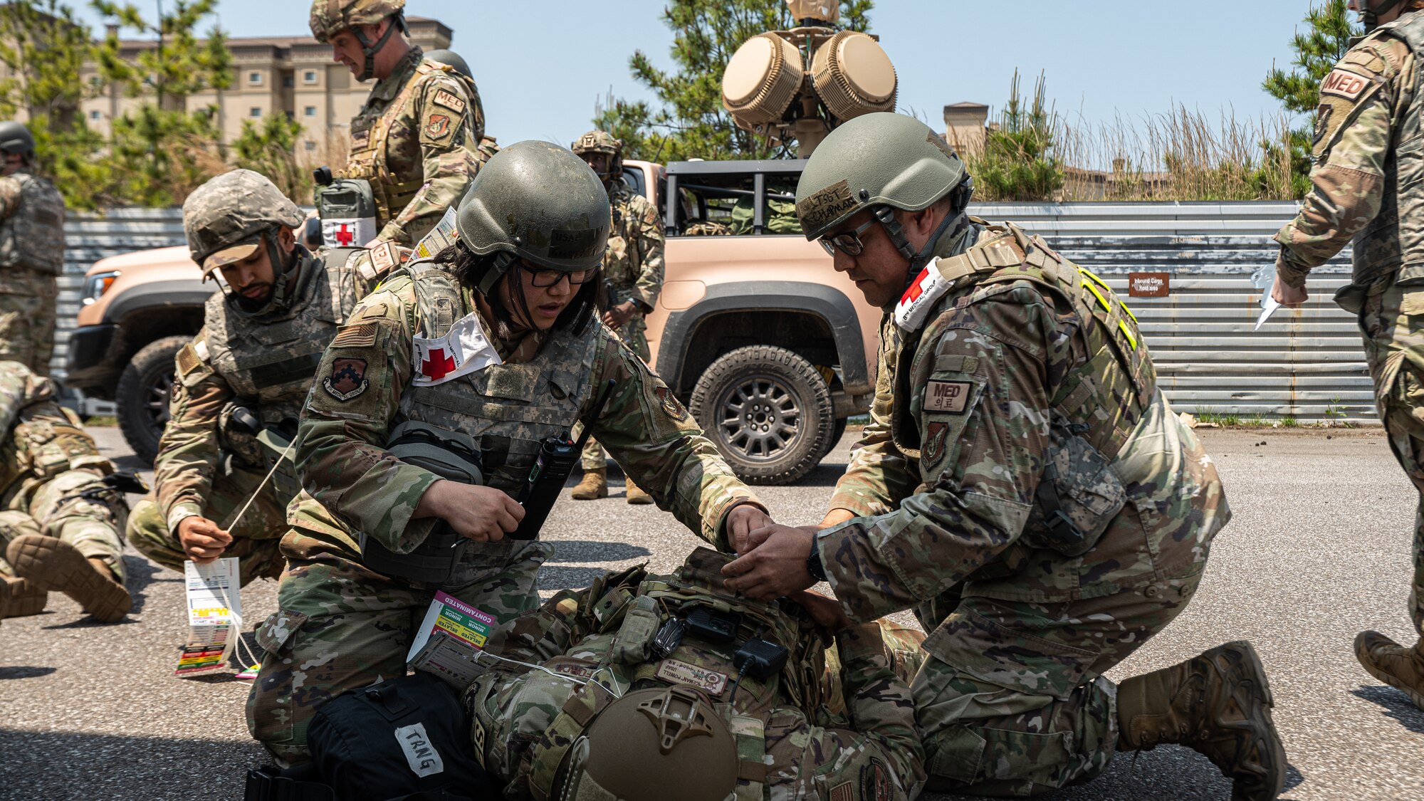 Airmen of the 8th Medical Group go through procedures of a mass casualty in a simulated training event.