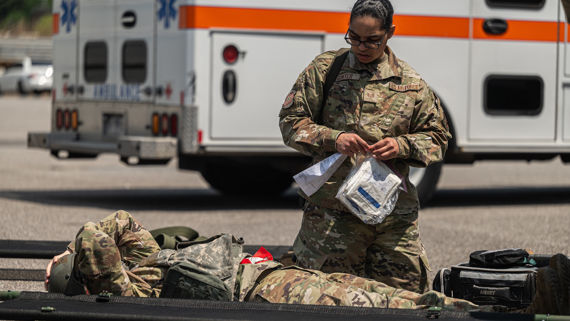 Staff Sgt. Bionca Gunter renders medical aid to a simulated casualty.