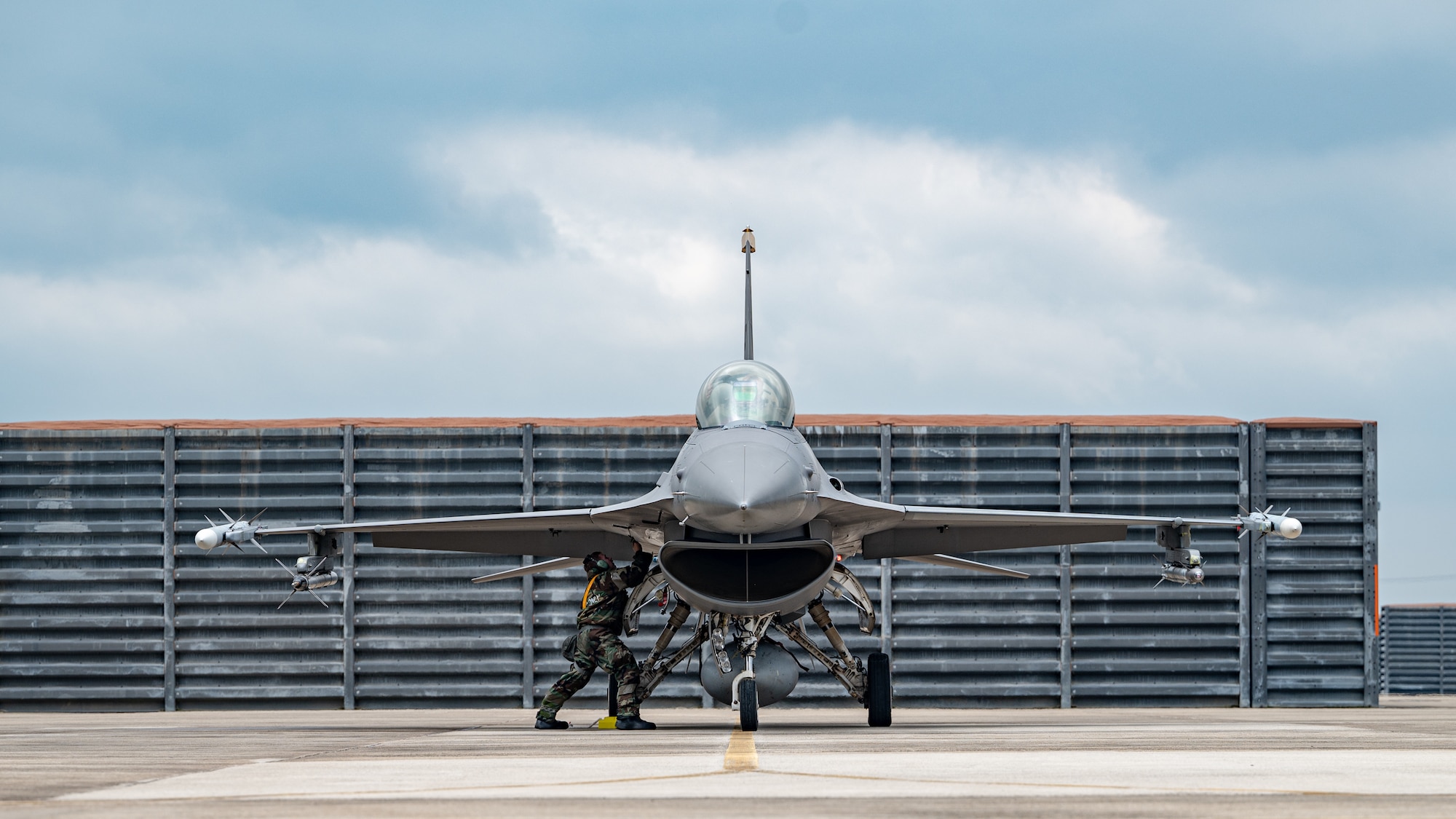 Senior Airmen Dawson Leake provides preventative maintenance on a F-16 Fighting Falcon.