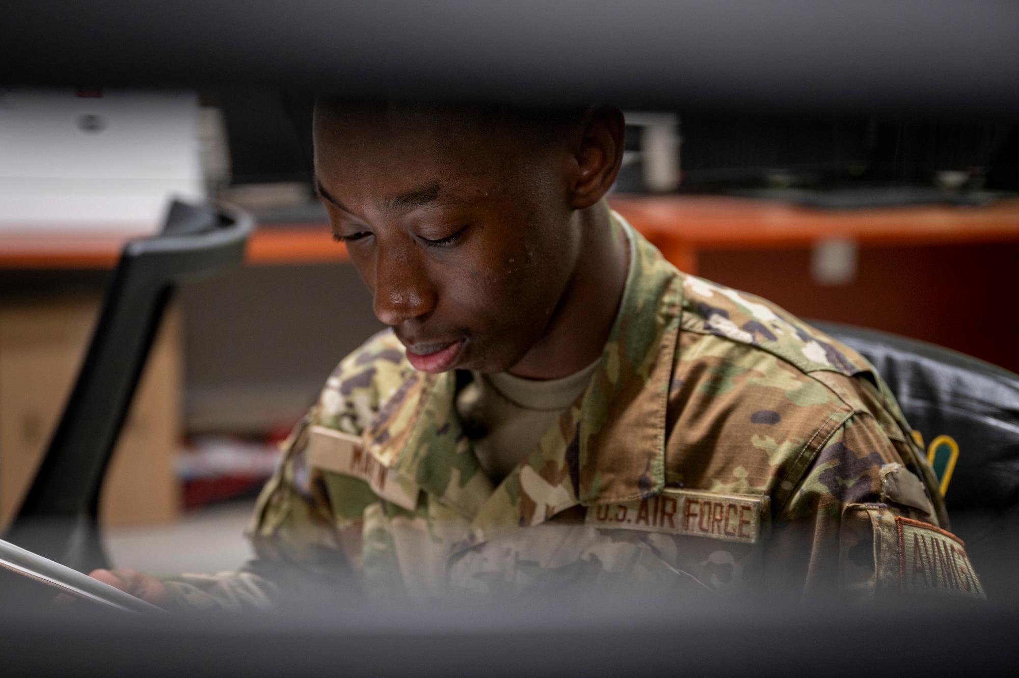 U.S. Air Force Airman 1st Class D’andrea Martin, 25th Fighter Squadron aviation resource manager, reviews a catalog at Osan Air Base, Republic of Korea, May 8, 2024. Martin’s exemplary skills earned him the title Mustang of the Week. He is responsible for organizing aircrew resources and activities and monitoring individual flight requirements, flying hours and aviation requirement changes. (U.S. Air Force photo by Senior Airman Sabrina Fuller-Judd)