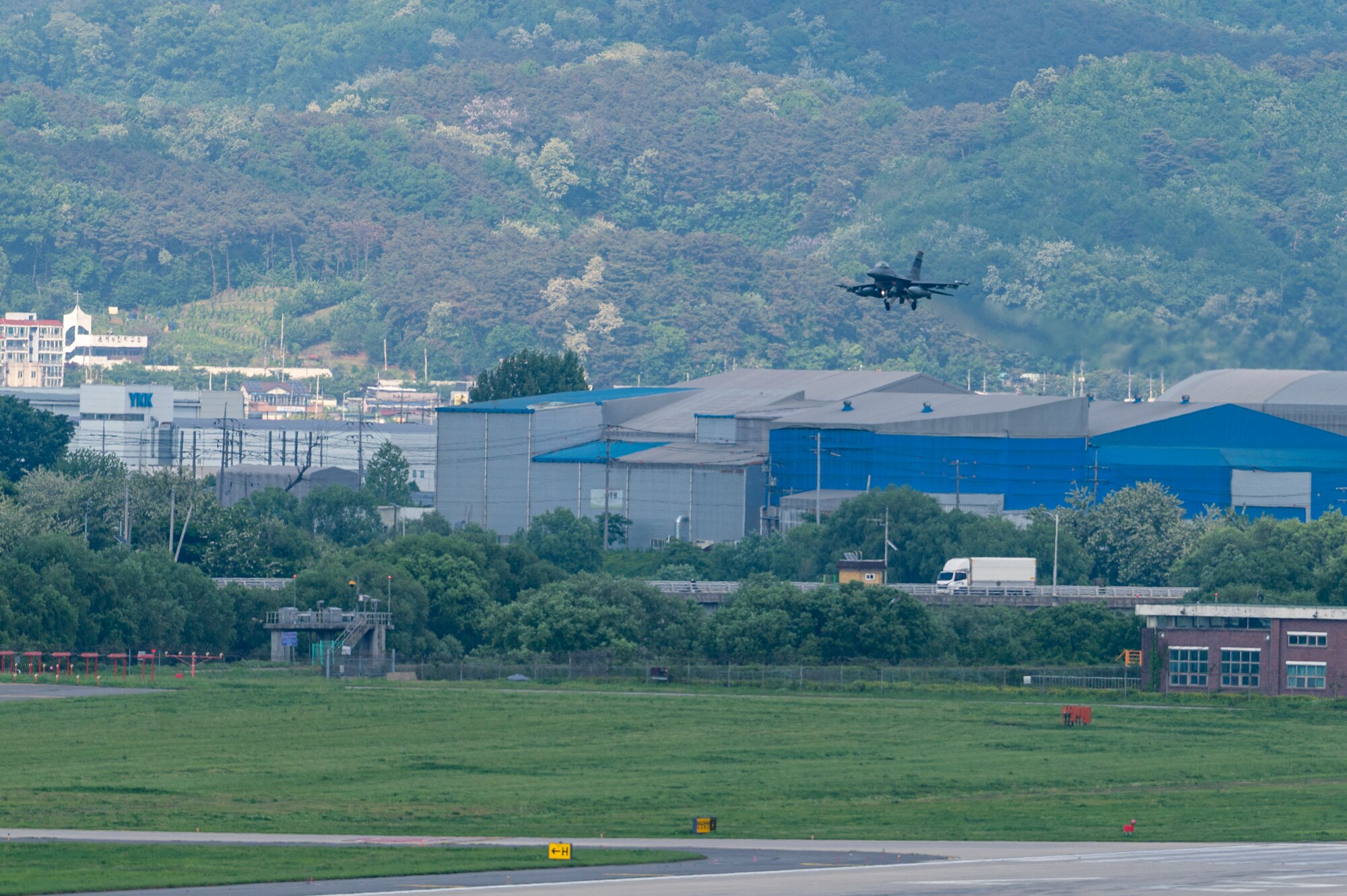 A U.S. Air Force F-16 Fighting Falcon assigned to the 36th Fighter Squadron prepares to land on a runway at Osan Air Base, Republic of Korea, May 8, 2024. Fourteen aircraft returned to Osan AB from Red Flag-Alaska 24-1. RF-A is a Pacific Air Forces-led training that is designed to enhance air operations, improve interoperability and strengthen alliances and partnerships. (U.S. Air Force Photo by Senior Airman Kaitlin Frazier)