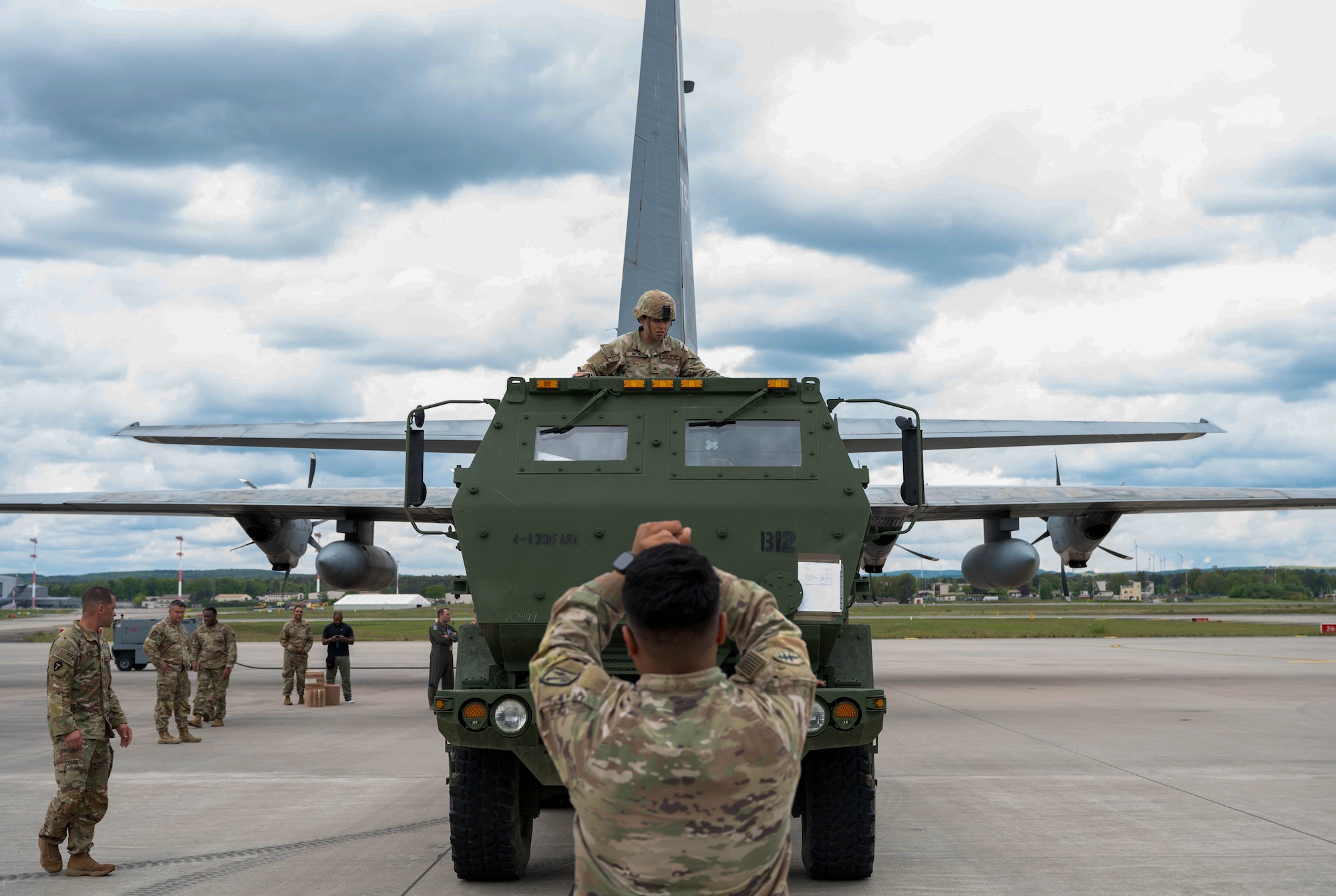 U.S. Army Soldiers assigned to the 4th Battalion,133rd Field Artillery Regiment, Texas Army National Guard, and the Tunisian Air Force train on the proper procedures for loading and lifting the M142 High Mobility Artillery Rocket System on a Tunisian C-130J Super Hercules aircraft at Ramstein Air Base, Germany, May 4, 2024.