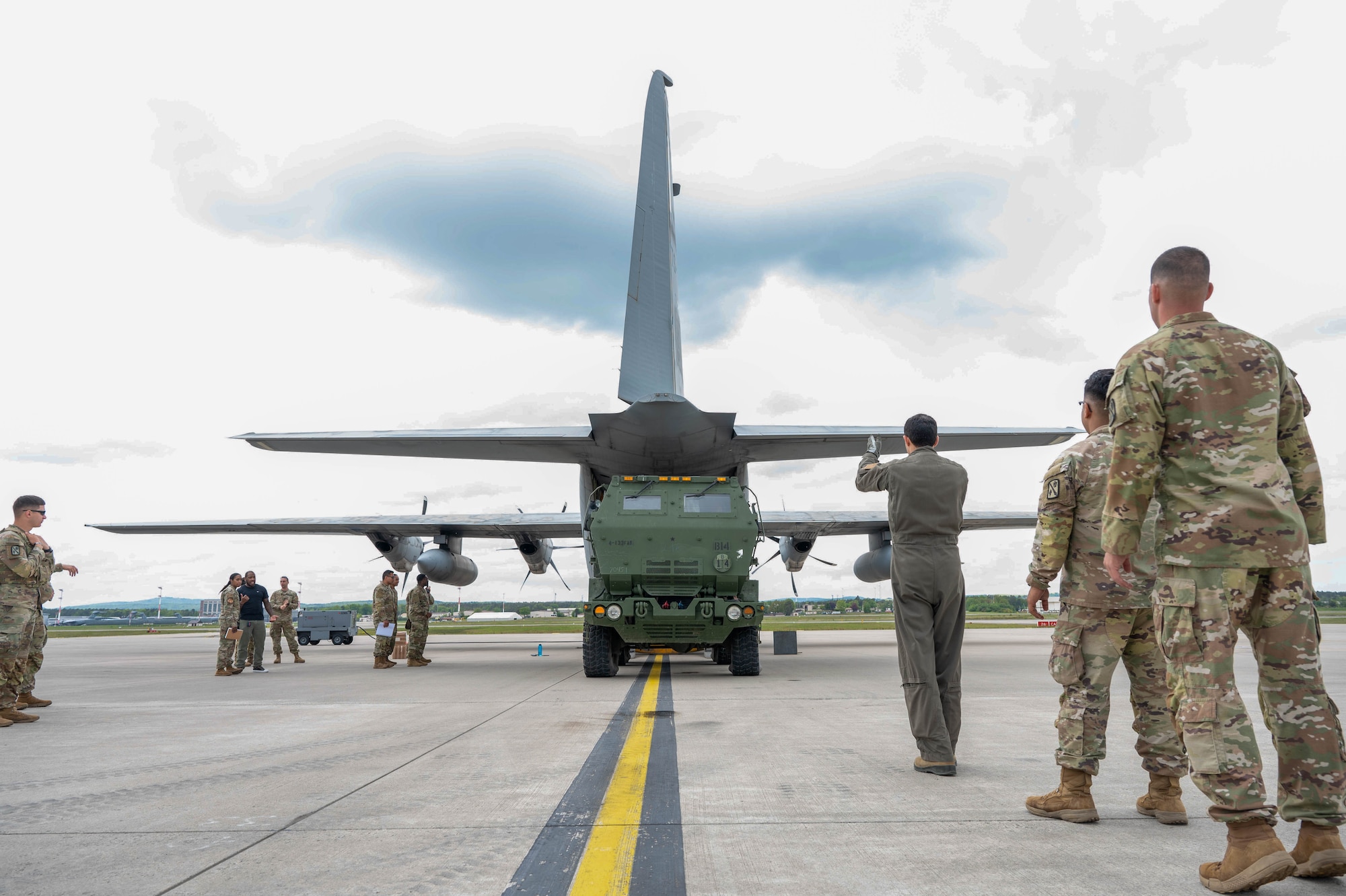 U.S. Army Soldiers assigned to the 4th Battalion,133rd Field Artillery Regiment, Texas Army National Guard, and the Tunisian Air Force train on the proper procedures for loading and lifting M142 High Mobility Artillery Rocket System on a TAF C-130J Super Hercules aircraft at Ramstein Air Base, Germany, May 4, 2024.