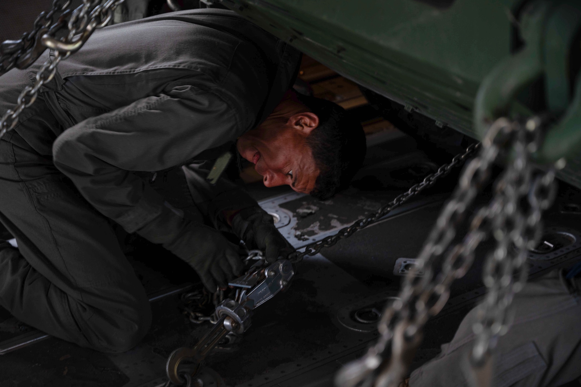A Tunisian Air Force loadmaster secures a M142 High Mobility Artillery Rocket System onto a Tunisian C-130J Super Hercules aircraft at Ramstein Air Base, Germany, May 4, 2024.