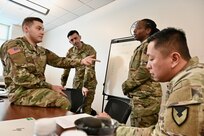 Service members comprised of different ranks and military occupational specialties partake in a group exercise during the Common Faculty Development-Instructor Course (CFD-IC) at the District of Columbia National Guard’s 260th Regiment Regional Training Institute (RTI) at Fort Belvoir, Va., March 15, 2024. The course teaches new instructors, trainers, and facilitators how to build lesson plans and effectively reach their intended audience.