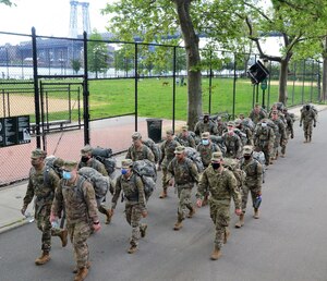New York Army National Guard medics assigned to the Headquarters Company of the 1st Battalion, 69th Infantry, conduct a road march in New York City May 16, 2021. In the 2024 Northeast region Best Warrior Competition, 16 Soldiers from New York, New Jersey and New England will participate in events across New York state.