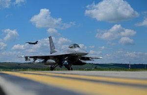 A U.S. Air Force F-16 Fighting Falcon assigned to the 555th Fighter Generation Squadron arrives at Câmpia Turzii, Romania, for exercise Astral Knight 24, May 10, 2024. AK24 is U.S. European Command’s capstone integrated air and missile defense exercise focused on incremental development of the theater-wide coalition IAMD capabilities. (U.S. Air Force photo by Senior Airman Raya Feltner)
