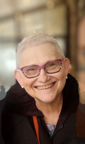 The bio photo of Mrs. Connie Liss, the daughter for Holocaust survivors and an active voice educating existing and future generations about the enormous human toll brought by the Holocaust. In the photo Liss is warmly smiling and is wearing glasses and a brown top. Liss recently spoke to members of the Strategic Systems Programs (SSP) workforce about her mother's experiences as a Holocaust survivor who was held for three years at Auschwitz. Her presentation was part of SSP's Special Emphasis Programs, which are employee-engagement programs that illuminate underrepresented groups and topics in an effort to highlight diversity within the workforce.