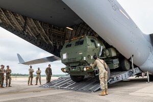 A U.S. Army M142 High Mobility Artillery Rocket System from Alpha Battery, 5-113th Field Artillery Battalion, North Carolina National Guard, is loaded into a C-17 Globemaster III aircraft with the 167th Airlift Wing as part of a live-fire exercise during exercise Sentry Unicorn 2024 at Holland Drop Zone, Vass, North Carolina, Apr. 20, 2024. Held in tandem with the West Virginia National Guard Sentry Storm exercise, Sentry Unicorn 2024 served as a Readiness Exercise Validation to gauge the wing’s self-assessment capabilities.