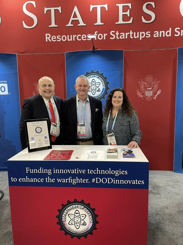 DoD SBIR/STTR Tabletop at USG Resources for Startups and Small Businesses at CES 2024, Las Vegas, Nevada
Pictured Left to Right: Chad Rogers (Contractor Support), Ian Roth (Contractor Support), Anne Neumann (Contractor Support).