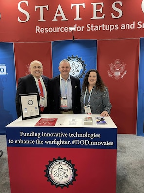 DoD SBIR/STTR Tabletop at USG Resources for Startups and Small Businesses at CES 2024, Las Vegas, Nevada
Pictured Left to Right: Chad Rogers (Contractor Support), Ian Roth (Contractor Support), Anne Neumann (Contractor Support).