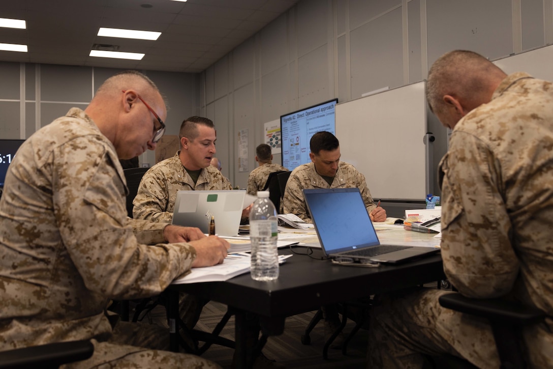 U.S. Marines attending the Ground Combat Element Commander’s Course 24-2, hosted by the Marine Corps Tactics and Operations Group, participate in peer-to-peer discussion at Marine Corps Air-Ground Combat Center, Twentynine Palms, California, April 19, 2024. The MCTOG GCECC is a five day operationally focused command preparation course to better ready ground combat element commanders to lead, train, and tactically employ their battalions and regiments in the context of maneuver warfare in support of the Marine Air-Ground Task Force. This product contains blurred components due to Operational security. (U.S. Marine Corps photo by Lance Cpl. Enge You)