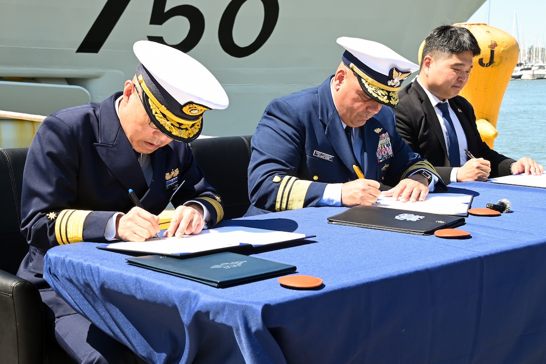 Vice Adm. Watanabe Yasunori, Japan coast guard vice commandant for operations (left), U.S. Coast Guard Vice Adm. Andrew Tiongson, commander, and Hyunchul Kang, deputy Consul General of the Republic of Korea, signs a trilateral letter of intent at Coast Guard Island, Alameda, Calif., May 9, 2024. Watanabe visited Coast Guard Pacific Area to finalize a trilateral letter of intent between U.S. Coast Guard, Japan and Korea coast guards, which will drive the three nations’ coast guards to work together to advance maritime safety, security and prosperity in the Indo-Pacific. (U.S. Coast Guard photo by Master Chief Petty Officer Charly Tautfest)
