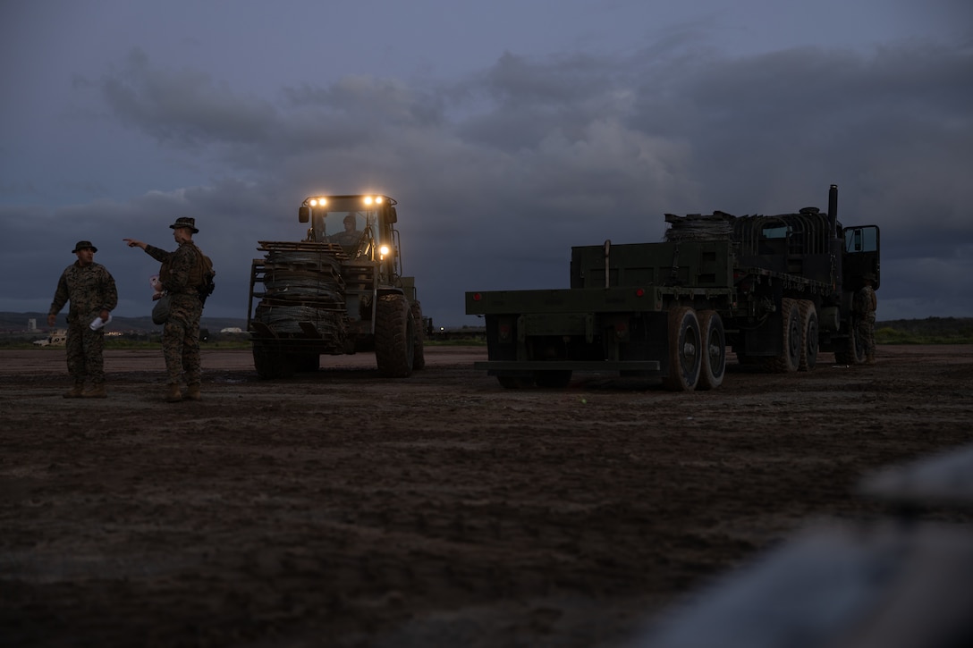 U.S. Marines with Combat Logistics Regiment 17, 1st Marine Logistics Group, transfer gear with a Tractor, Rubber-Tired, Articulated Steering, Multipurpose (TRAM) forklift during CLR-17's Command Post Exercise III at Camp Pendleton, California, March 3, 2024. CPX III was conducted to improve the 1st MLG’s capabilities in intelligence and logistic operations, future planning, and combat readiness in preparation for Exercise Valiant Shield 2024 commencing this summer. (U.S. Marine Corps photo by Lance Cpl. Hannah Hollerud)