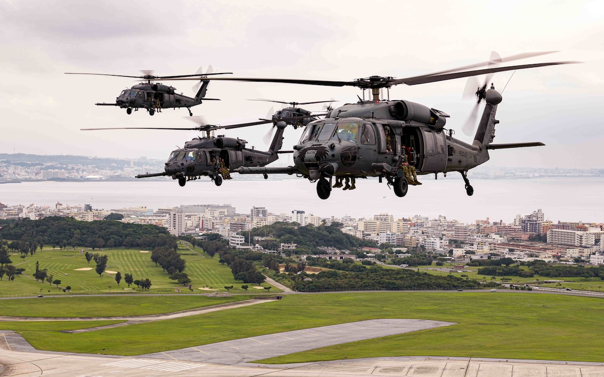 U.S. Air Force HH-60G Pave Hawks assigned to the 33rd Rescue Squadron fly in formation over Kadena Air Base, Japan, April 16, 2024. The HH-60G has provided combat rescue, disaster relief, casualty evacuation and the ability to respond to anyone in need, whether it be in the jungle or sea, since 1990. (U.S. Air Force photo by Airman 1st Class Catherine Daniel)