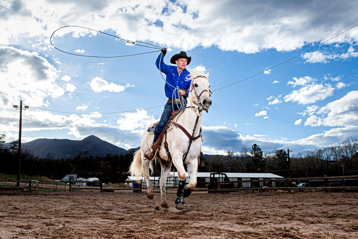 Cadet 1st Class Robert Ball, team captain of the U.S. Air Force Academy Rodeo Club, rides his horse, Ferg, during practice at the Academy's Equestrian Center in Colorado Springs, Colo., April 29, 2024. The cadet rodeo club participates in five rodeos each semester including bull riding, team roping, barrel racing, calf roping and steer wrestling events. (U.S. Air Force photo by Trevor Cokley)