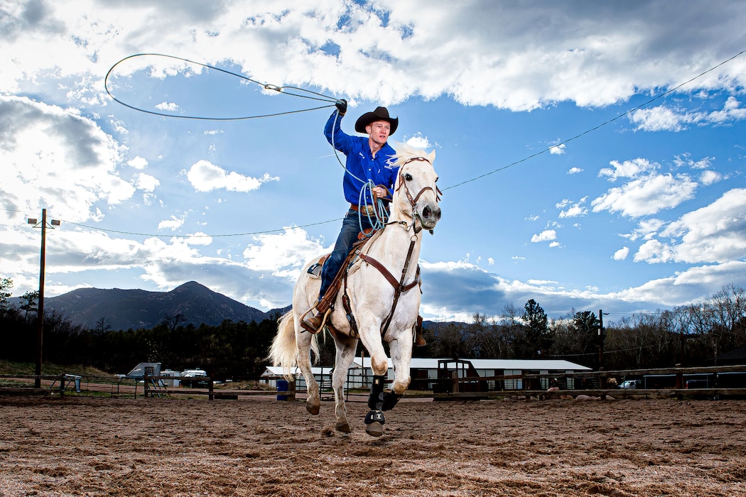 Cadet 1st Class Robert Ball, team captain of the U.S. Air Force Academy Rodeo Club, rides his horse