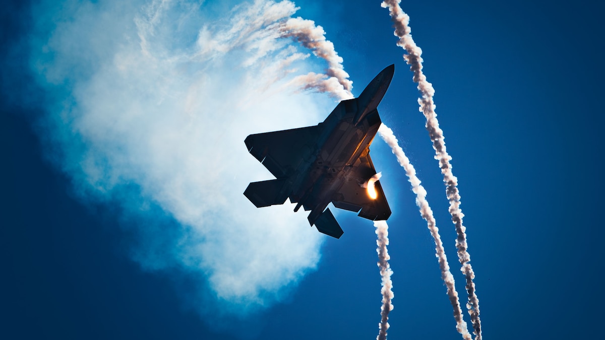 An F-22 Raptor, flown by Capt. Samuel Larson, F-22 Raptor Demonstration Team pilot, deploys flares over the Gulf of Mexico during the 2024 Gulf Coast Salute Air Show at Panama City Beach, Fla., May 4, 2024. The F-22’s unique combination of stealth, speed, agility and situational awareness, combined with lethal long-range air-to-air and air-to-ground weaponry, makes it one of the most advanced fighters in the world. (U.S. Air Force photo by Staff Sgt. Stefan Alvarez)