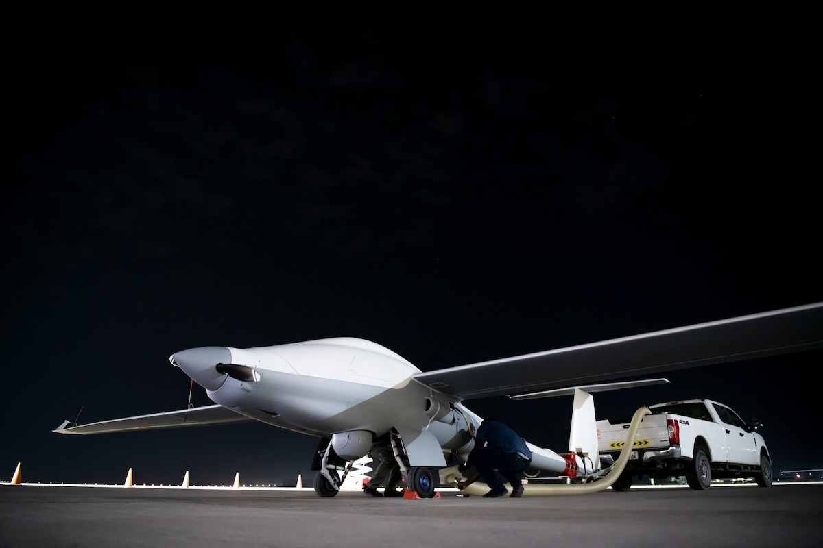 Unmanned Long-Endurance Tactical Reconnaissance Aircraft crew chiefs, assigned within the U.S. Central Command area of responsibility, prep an ULTRA aircraft for taxi across the flightline before an early morning takeoff at an undisclosed location, May 7, 2024. ULTRA is an unmanned aerial system capable of flight times up to 80 hours, providing intelligence, surveillance and reconnaissance capabilities to combatant commanders, with a smaller operational footprint than other UAS in its class. (U.S. Air Force photo by Tech. Sgt. Kregg York)