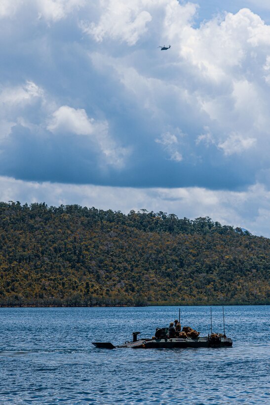 U.S. Marines assigned to Alpha Company, Battalion Landing Team 1/5, 15th Marine Expeditionary Unit, move towards the firing line to conduct a waterborne gunnery live-fire training in amphibious combat vehicles during Exercise Balikatan 24 in Oyster Bay, Philippines, May 4, 2024.