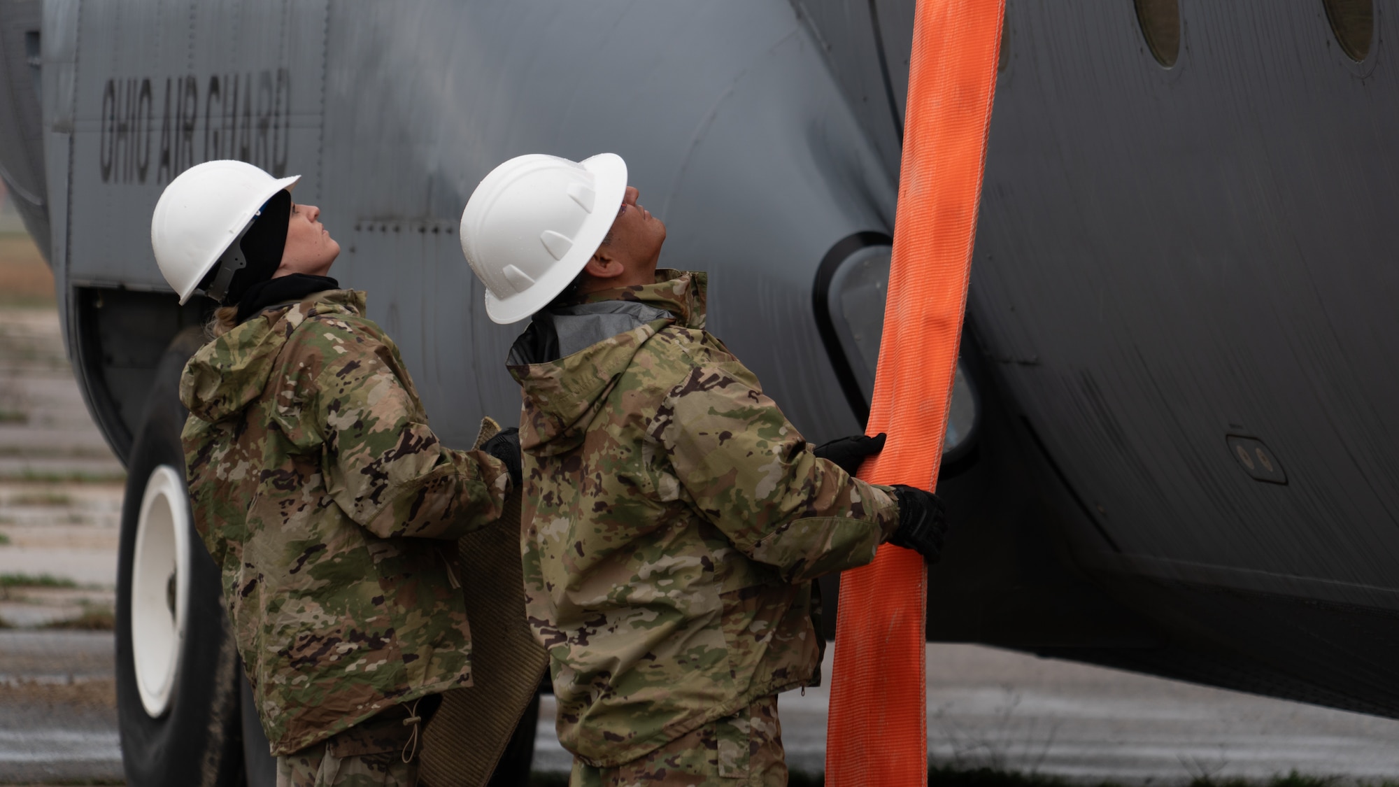 U.S. Air Force Airmen assigned to the 146th Maintenance Group part of the 146th Airlift Wing based on Channel Islands Air National Guard Station (CIANGS), practice executing the fundamentals of Crash Damaged and Disabled Aircraft Recovery (CDDAR) on Volk Field in Camp Douglas, Wisconsin April 16-18, 2024. The CDDAR certified members and augmentees used airbags, forklifts and cranes to raise, pull and stabilize aircraft that simulated different scenarios of downed airplanes. (U.S. Air National Guard photo by Staff Sgt. Kalia Jenkins)