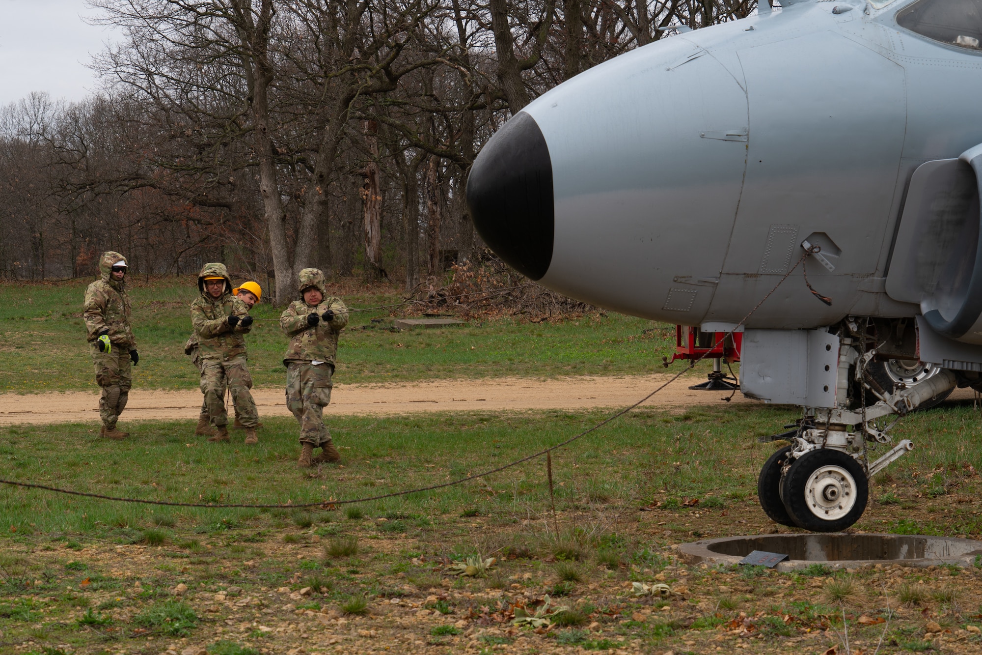 U.S. Air Force Airmen assigned to the 146th Maintenance Group part of the 146th Airlift Wing based on Channel Islands Air National Guard Station (CIANGS), practice executing the fundamentals of Crash Damaged and Disabled Aircraft Recovery (CDDAR) on Volk Field in Camp Douglas, Wisconsin April 16-18, 2024. The CDDAR certified members and augmentees used airbags, forklifts and cranes to raise, pull and stabilize aircraft that simulated different scenarios of downed airplanes. (U.S. Air National Guard photo by Staff Sgt. Kalia Jenkins)