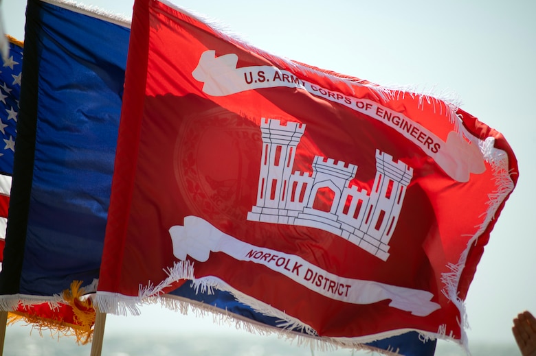 The USACE, Norfolk District flag waves in the wind during the AOC Phase II Groundbreaking ceremony.