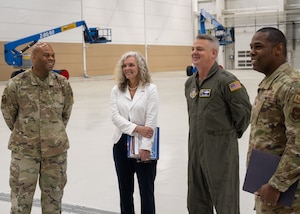 From left, Chief Master Sgt. Travon Dennis, 4th Air Force command chief, Mrs. Jennifer Durham, Maj. Gen. D. Scott Durham, 4th AF commander, and Lt. Col. Jerome Rogers, 512th Maintenance Group commander, tour Hangar 709 May 4, 2024, on Dover Air Force Base, Delaware. The new hangar is the first constructed on base in over 40 years. (U.S. Air Force photo by Senior Airman John Rossi)