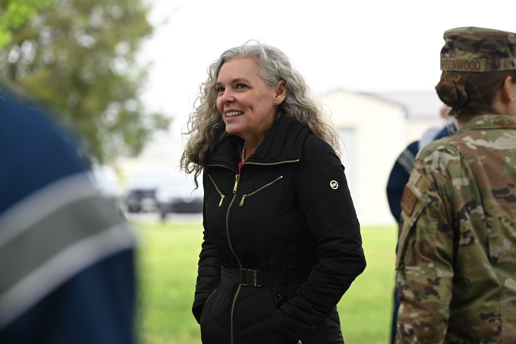 Mrs. Jennifer Durham talks with Airmen from the 46th Aerial Port Squadron during the Port Dawg Memorial Run May 5, 2024, on Dover Air Force Base, Delaware. The memorial run honors fallen U.S. Air Force aerial port members. (U.S. Air Force photo by Senior Airman John Rossi)